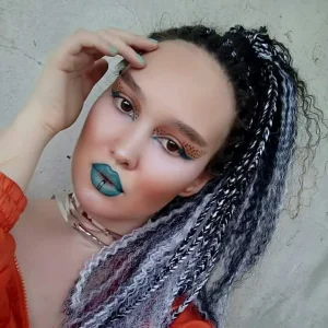 Diana with braids and blu lipstick